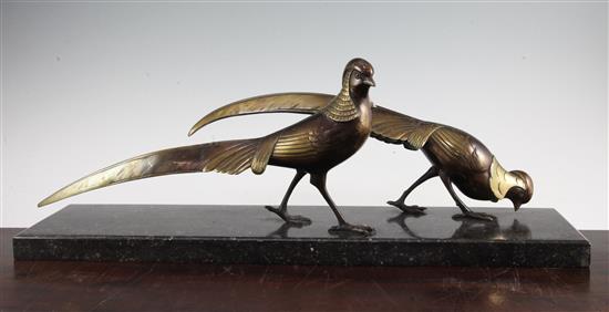 A French Art Deco patinated bronze model of two pheasants, 24in.